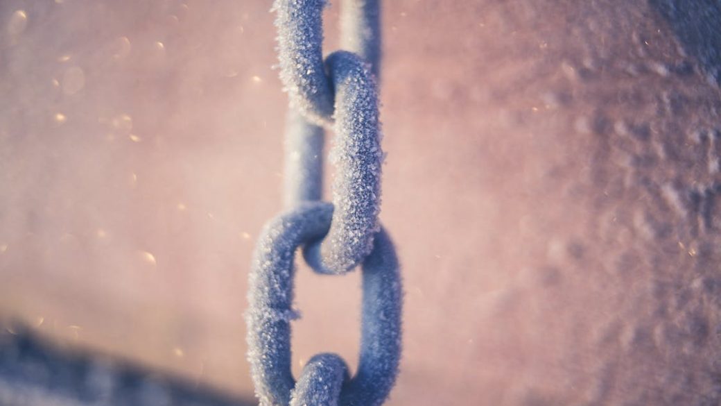ice covered chain linkk